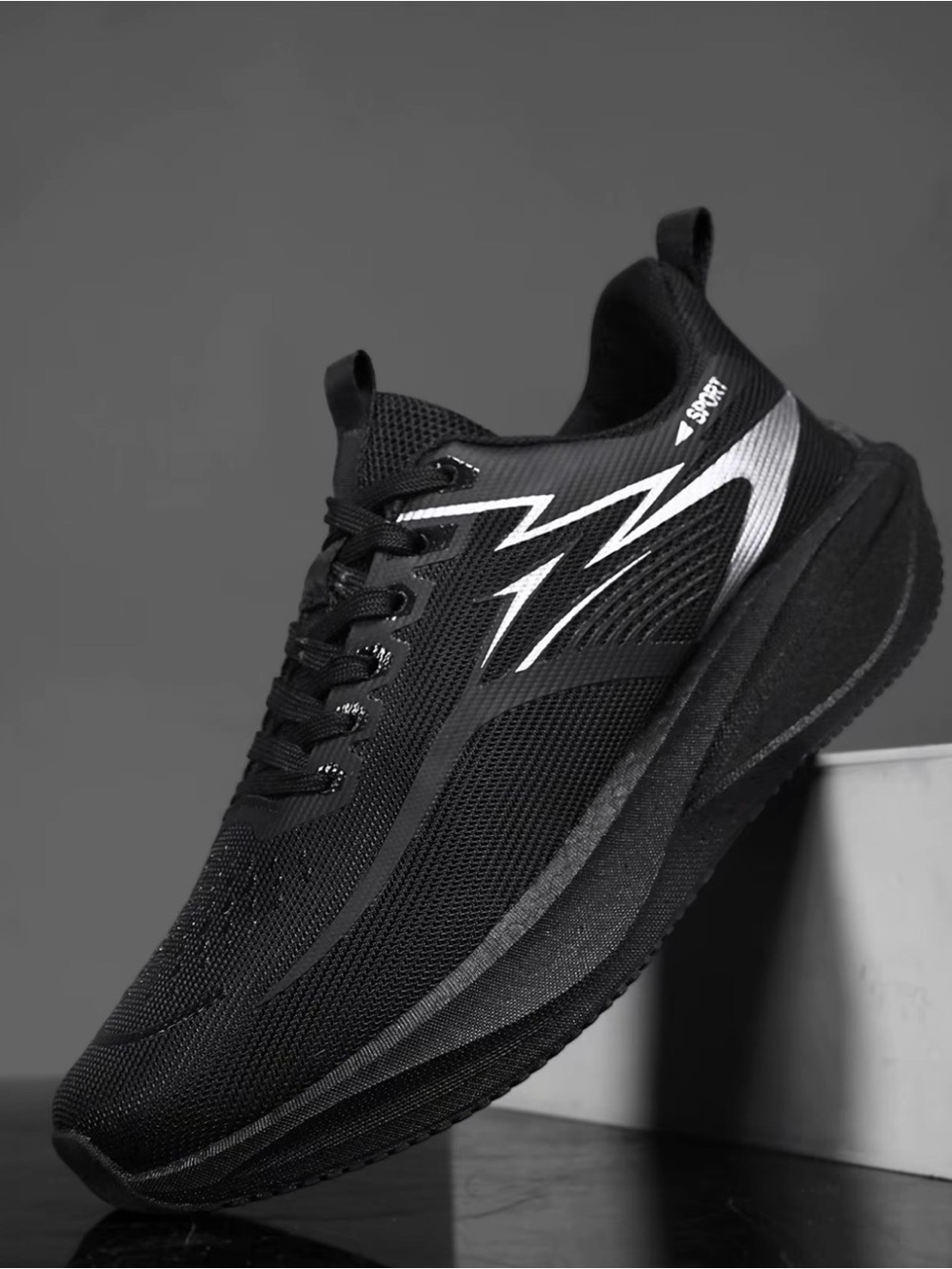 Black Athletic Running Shoe with Silver Accent